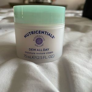 NuSkin Dew All Day moisturizer.